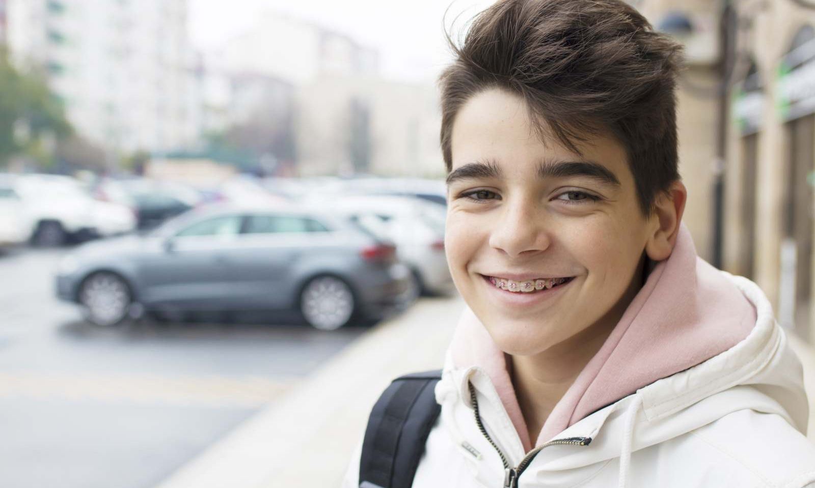 Teenage boy smiling with braces