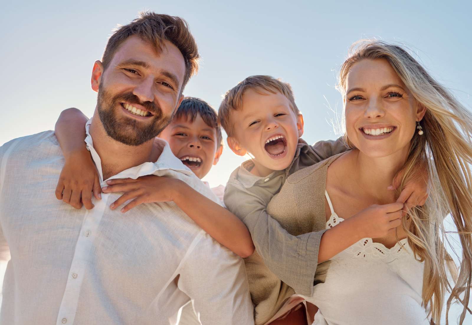 A happy couple with their two young boys